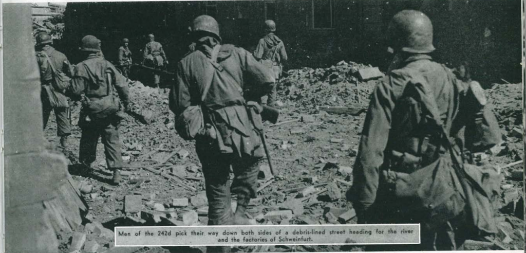 soldiers moving through destroyed town