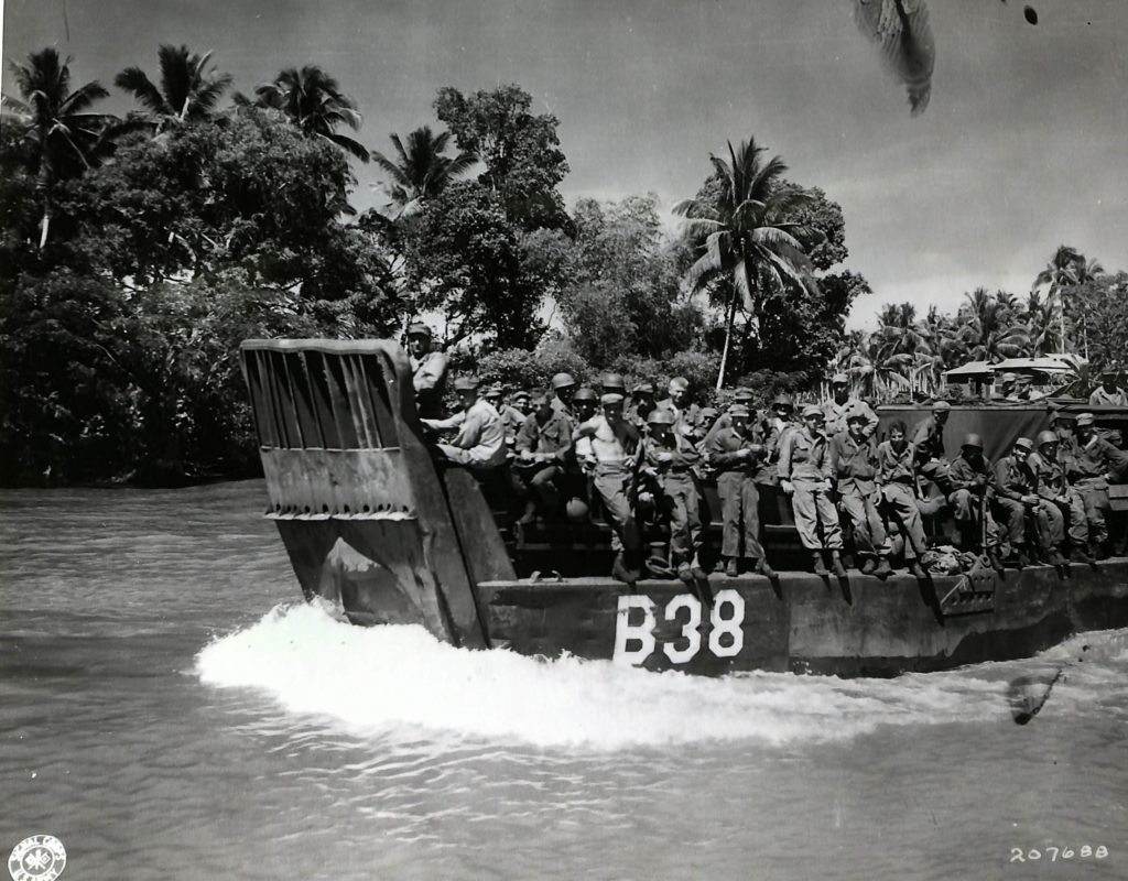 Landing craft carrying troops of Company I, 34th Infantry Regiment, 24th Infantry Division troops up the Mindanao River for the assault on Fort Pikit, April 1945.