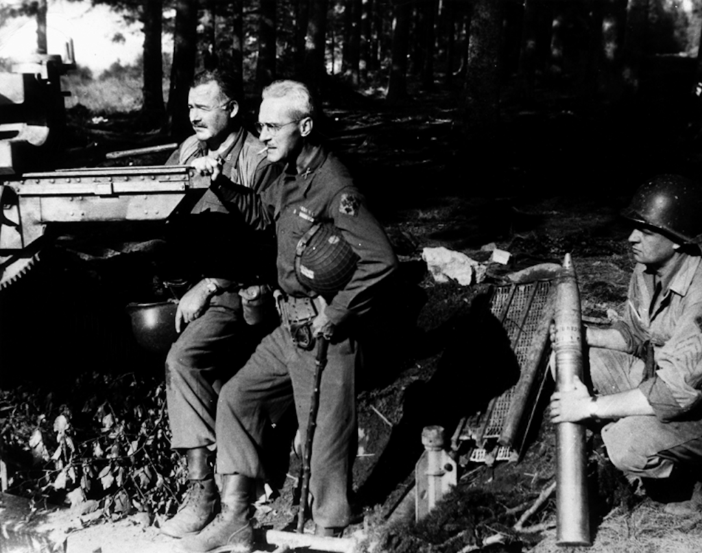 Ernest Hemingway and Colonel Charles T. "Buck" Lanham with captured artillery in Schweiler, Germany, 18 September 1944.