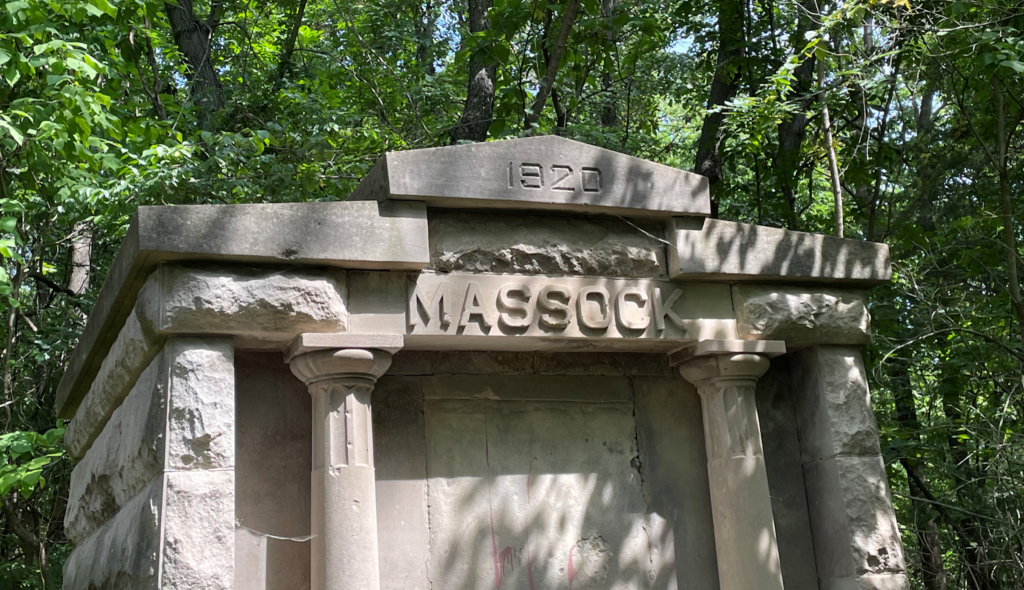The top of the Massock Mausoleum showing the surname Massock and date 1920