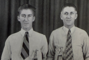 Photo of Stanley Sr and Jr with their bowling trophy, black and white photo